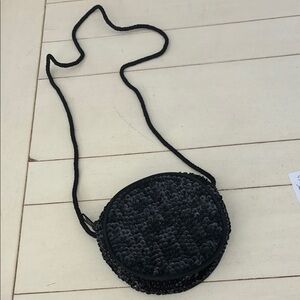 Sequined round evening shoulder bag.